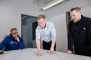Expert team collaborating at the office during a bakery project.